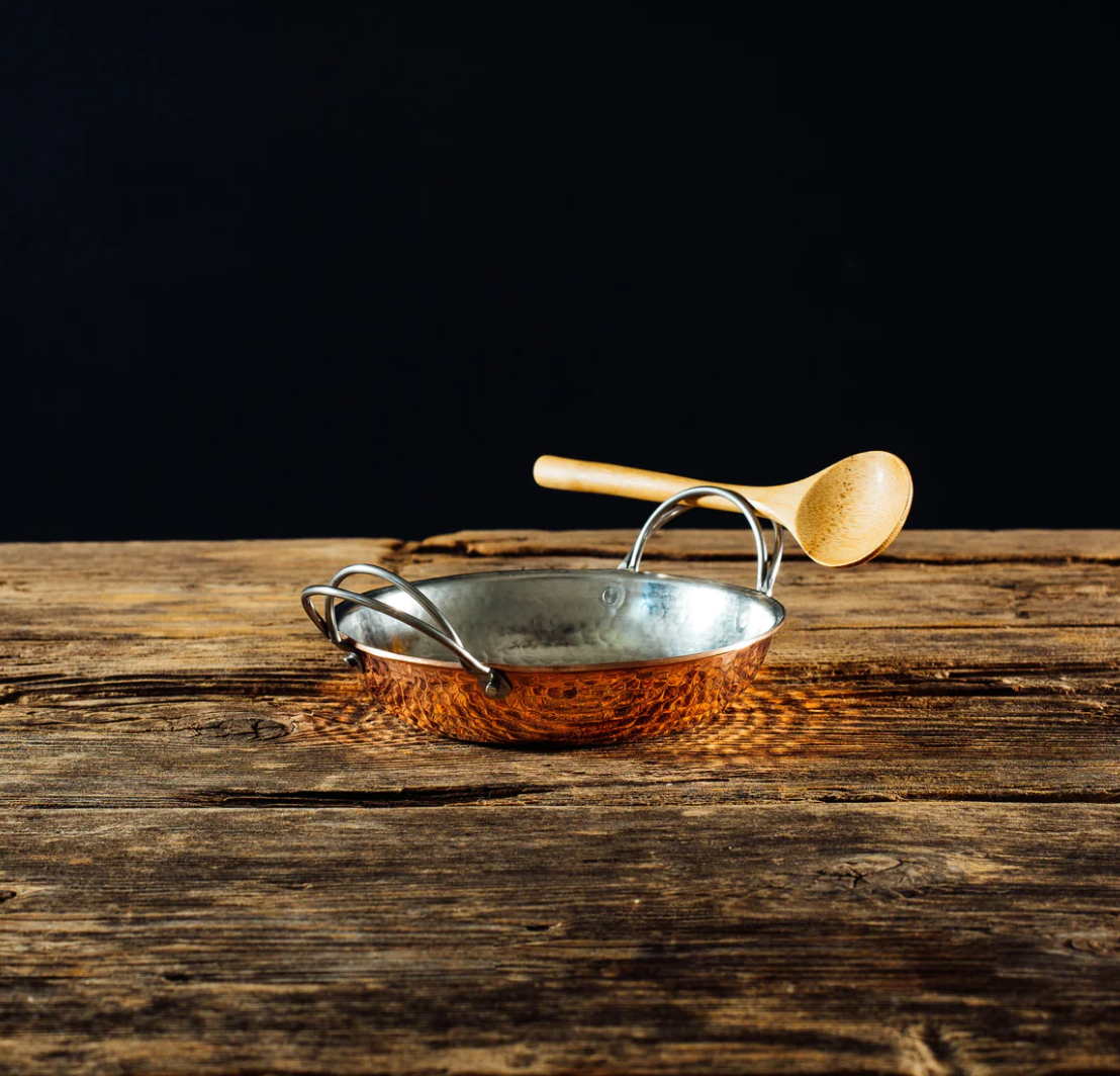 Hammered copper paella pan with stainless steel handle